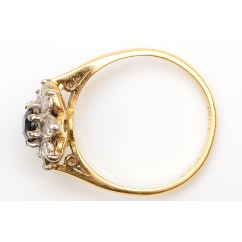 229 - An 18ct gold sapphire and diamond cluster ring, N, 3.7gm