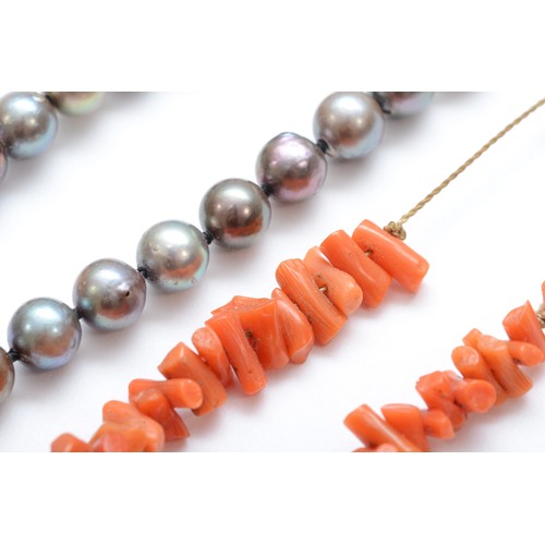 234 - A single row 7mm bead black cultured pearl necklace, 47cm and a branch coral necklace.