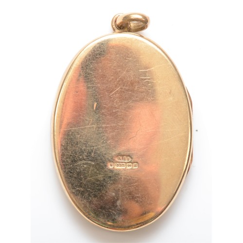 254 - A 9ct gold oval photograph locket, 35 x 24mm, 9.3gm