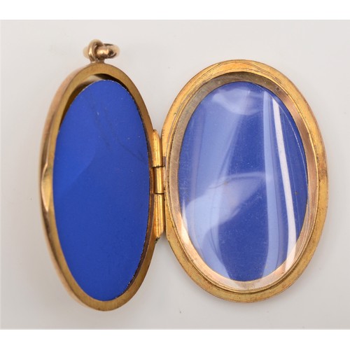 254 - A 9ct gold oval photograph locket, 35 x 24mm, 9.3gm