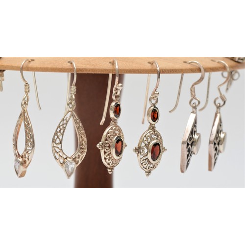 259 - Six pairs of silver and gemset ear rings, together with an ear ring stand