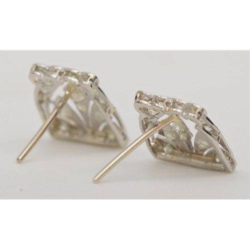 260 - An Art Deco white metal and diamond pair of ear studs, electronically tested as platinum, 12 x 10mm,... 