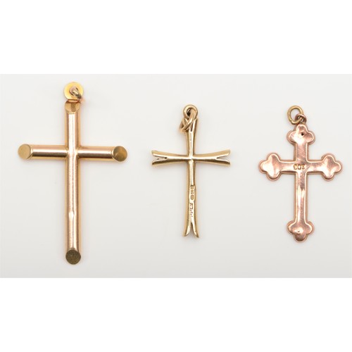 268 - A vintage 9ct rose gold cross pendant, 25mm and two other 9ct gold cross pendants, 3.6gm