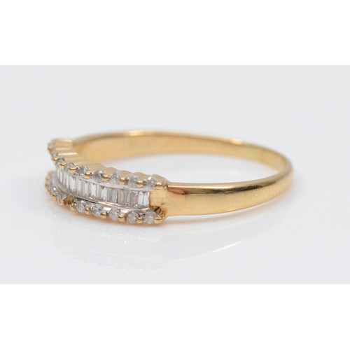 284 - An 18ct gold baguette and brilliant cut diamond dress ring, R, 2.9gm