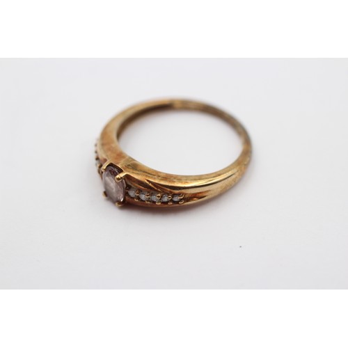 297 - A 9ct gold grey stone (chipped) and brilliant cut diamond dress ring, O 1/2, 2.8gm