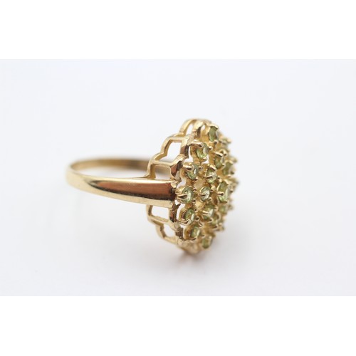 300 - A 9ct gold and peridot cluster ring, 19 x 15mm, P 1/2, 3.8gm