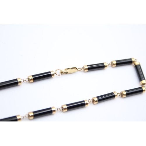 315 - A 9ct gold and onyx panel necklace, 40cm