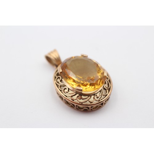 319 - A 14ct gold and citrine pendant, stone, 18 x 15mm, 7.1gm