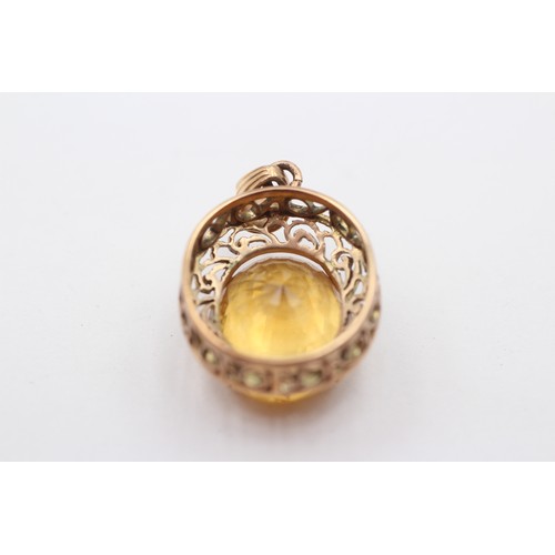 319 - A 14ct gold and citrine pendant, stone, 18 x 15mm, 7.1gm