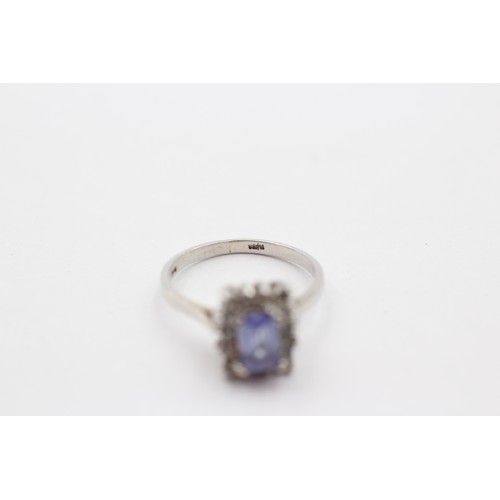 320 - A 9ct white gold tanzanite and diamond cluster ring, J 1/2, 2.6gm