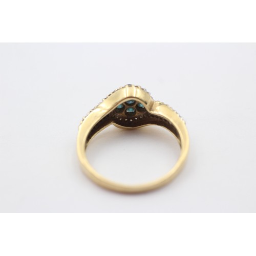 321 - A gold and diamond cluster ring, tests as 14K, enhanced brilliant cut blue diamonds with brilliant a... 