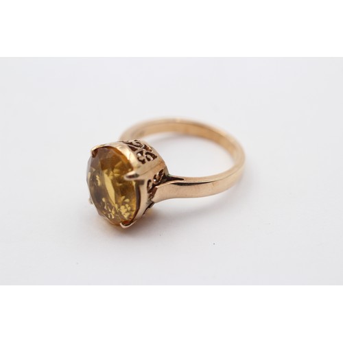 325 - A 14K gold and citrine single stone ring, 13 x 10mm, L, 4.6gm