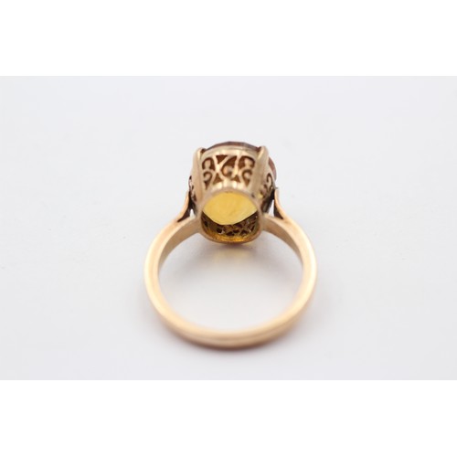 325 - A 14K gold and citrine single stone ring, 13 x 10mm, L, 4.6gm