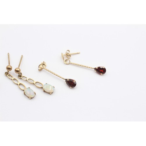 326 - A 9ct gold pair of opal and ruby cluster ear studs, an opal drop pair and a garnet drop pair, 3gm