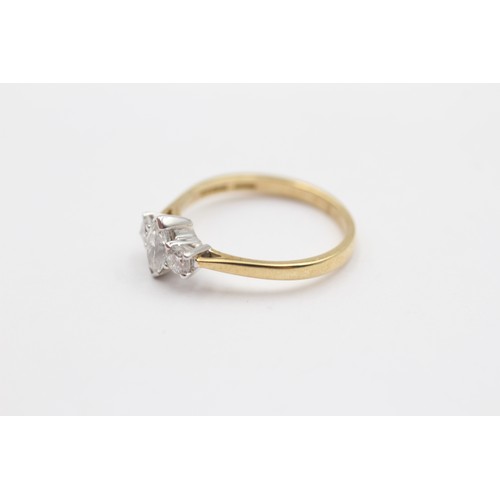 340 - An 18ct gold three stone diamond ring, claw set with a navette, flanked by brilliants, stated weight... 