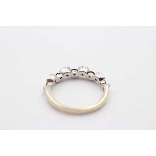 342 - An 18ct white gold champagne and white brilliant cut diamond wavy ring, O 1/2, 3.5gm