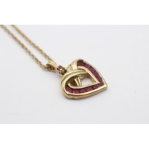 348 - A 9ct gold and ruby openwork heart pendant, 15 x 17mm, chain, 4.7gm