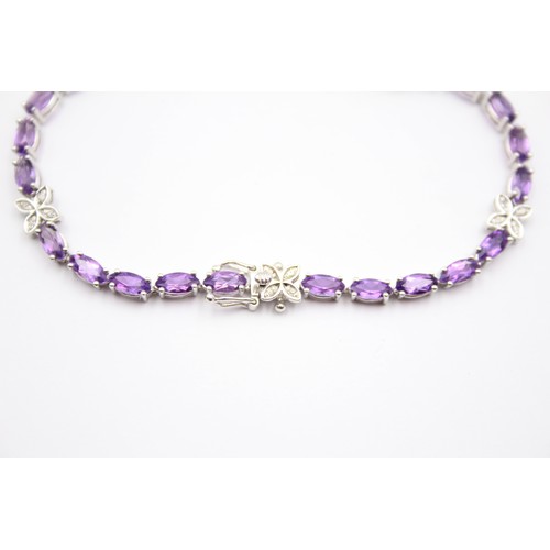 353 - A 9ct white gold amethyst and diamond line bracelet, 18.5cm, 7.6gm