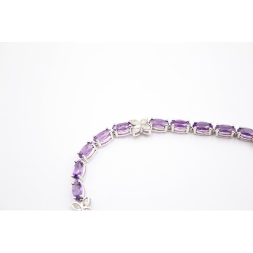 353 - A 9ct white gold amethyst and diamond line bracelet, 18.5cm, 7.6gm