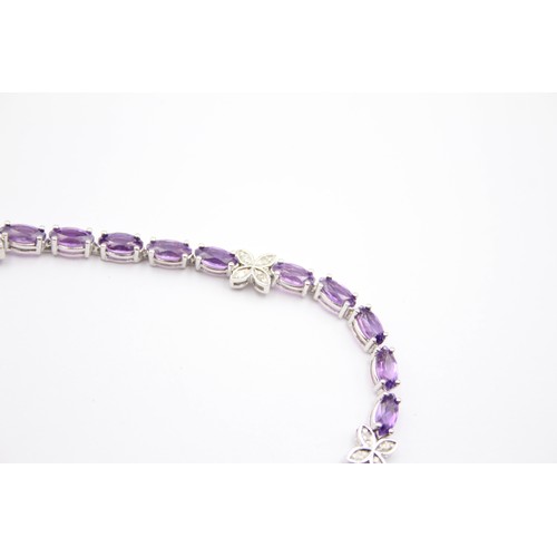 353 - A 9ct white gold amethyst and diamond line bracelet, 18.5cm, 7.6gm