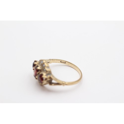 364 - A vintage 9ct gold garnet and half pearl dress ring, O, 3.1gm