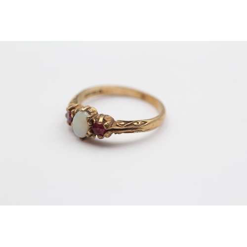 371 - A vintage 9ct gold ruby and opal three stone ring, N, 2.2gm