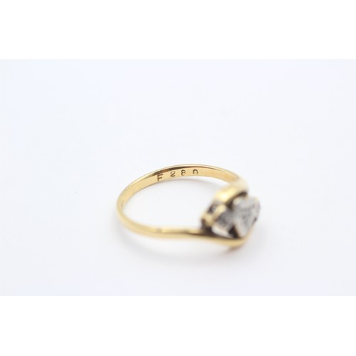 374 - A vintage 18ct gold and diamond three stone heart ring, L, 2.7gm