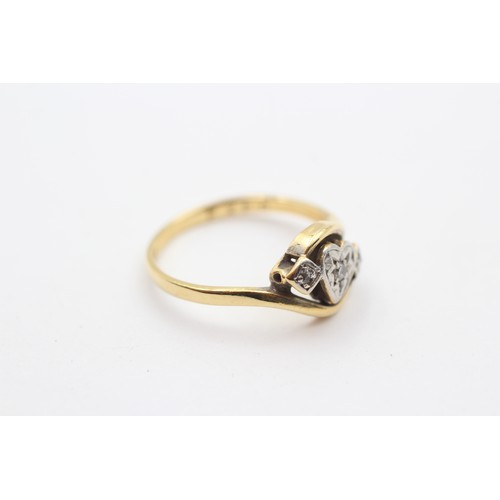 374 - A vintage 18ct gold and diamond three stone heart ring, L, 2.7gm