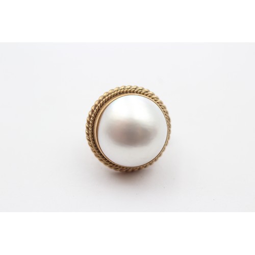 376 - A pair of 9ct gold and 13 mm Mabe pearl ear clips, 8.6gm