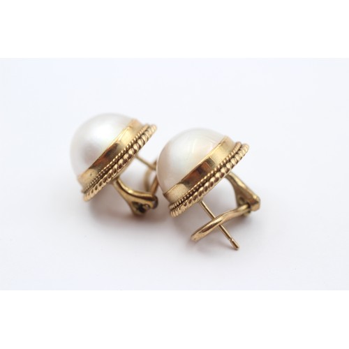 376 - A pair of 9ct gold and 13 mm Mabe pearl ear clips, 8.6gm