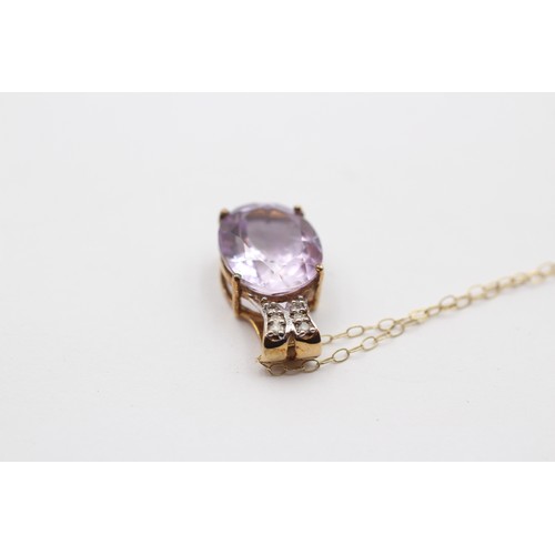 377 - A 9ct gold amethyst and diamond pendant, 18mm, chain, 2.4gm