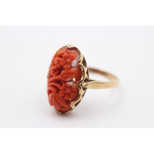 380 - A 10K gold carved coral panel ring, 20 x 12mm, P, 4.6gm