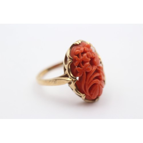 380 - A 10K gold carved coral panel ring, 20 x 12mm, P, 4.6gm