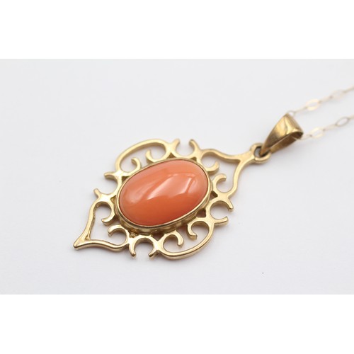 391 - A 9ct gold and coral openwork pendant, 40mm overall, chain, 4.2gm