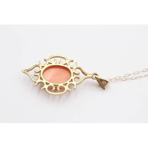 391 - A 9ct gold and coral openwork pendant, 40mm overall, chain, 4.2gm