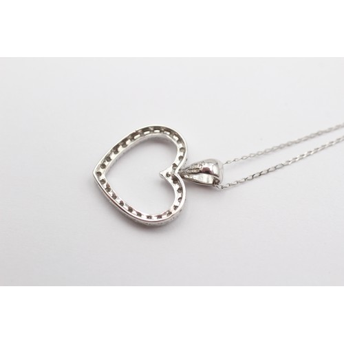 392 - A 9ct white gold and diamond openwork heart pendant, 20 x 17mm, chain, 1.7gm