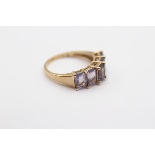 394 - A 9ct gold and purple gemstone set ring, M, 2.5gm