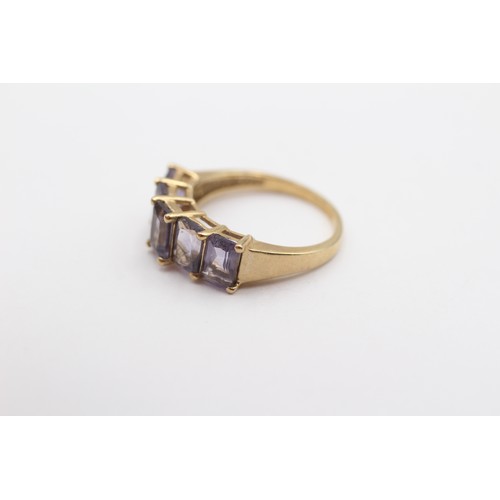 394 - A 9ct gold and purple gemstone set ring, M, 2.5gm