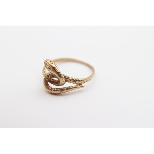 396 - A 9ct gold coiled snake ring, S, 2.5gm