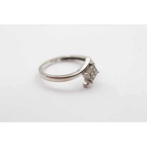 410 - A 9ct white gold and brilliant cut diamond square cluster ring, stated weight 0.15cts, N 1/2, 2gm