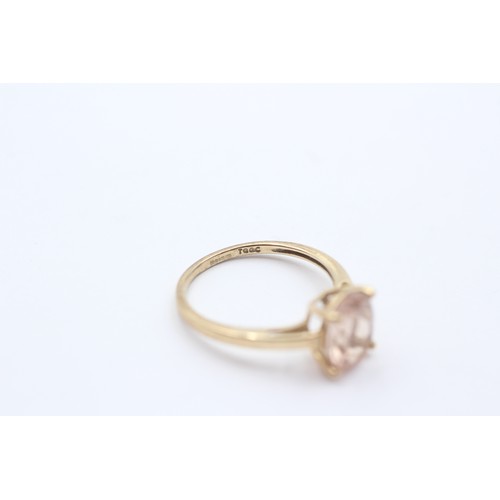 414 - A 9ct gold and oval morganite single stone ring, J 1/2, 1.5gm