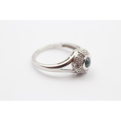 420 - A 9ct white gold cabochon blue stone and diamond cluster ring, N, 3.3gm