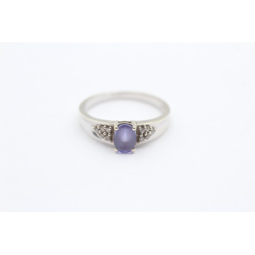 422 - A 9ct white gold tanzanite single stone ring, brilliant cut diamond set shoulders, Q, 3gm