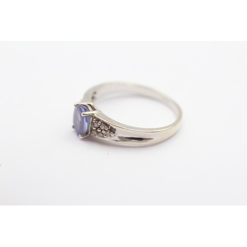 422 - A 9ct white gold tanzanite single stone ring, brilliant cut diamond set shoulders, Q, 3gm