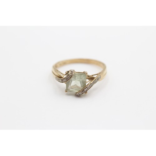 423 - A 9ct gold green quartz and diamond set dress ring, X, 3gm