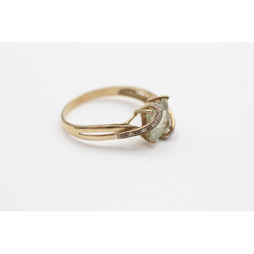 423 - A 9ct gold green quartz and diamond set dress ring, X, 3gm