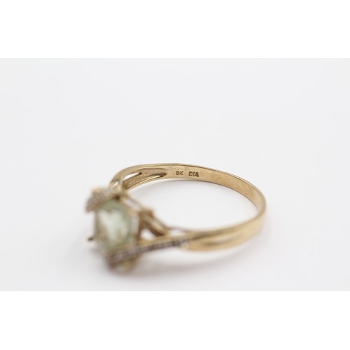 423 - A 9ct gold green quartz and diamond set dress ring, X, 3gm