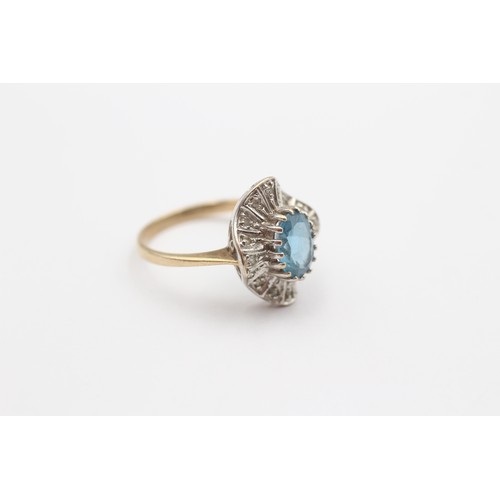 424 - A 9ct gold blue topaz and diamond cluster ring, M 1/2, 2.7gm