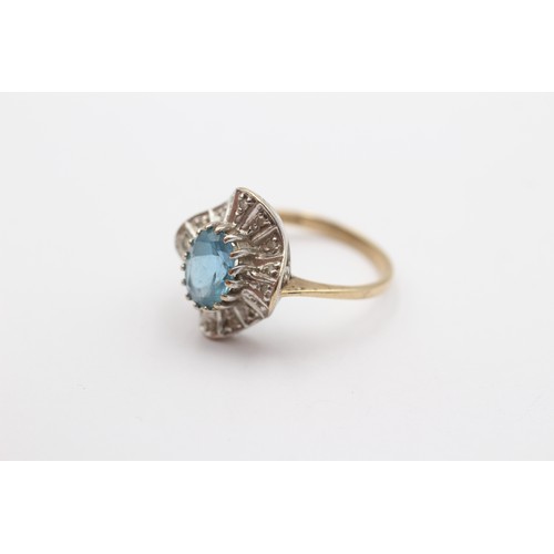 424 - A 9ct gold blue topaz and diamond cluster ring, M 1/2, 2.7gm