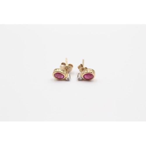 425 - A 9ct gold ruby and diamond pair of ear studs, 0.7gm